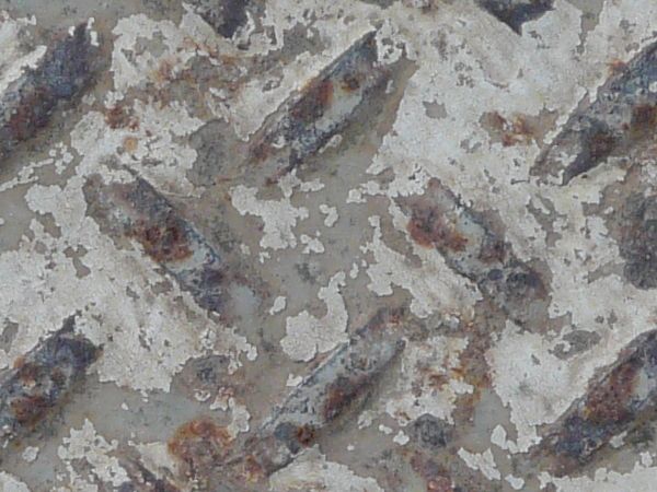 Old metal tread texture with repeating pattern and very worn surface.